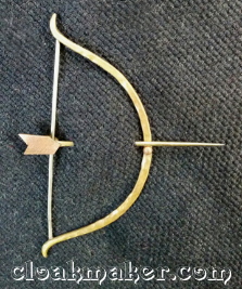 Penannular<br>Hammered Bronze and Nickle<br>Bow and Arrow