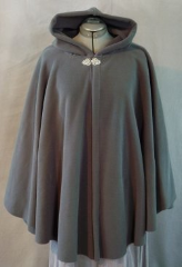 Cloak:1924, Cloak Style:Cape / Ruana, Cloak Color:Dark Storm Grey, Fiber / Weave:WindPro Fleece, Cloak Clasp:Tree of Life, Hood Lining:Self-lining, Back Length:33", Neck Length:23", Seasons:Winter, Fall, Spring, Note:This storm grey ruana is great for stormy weather! <br>Made of a wind-resistant fleece with a water-resistant finish. <br>Finished with a pewter Tree of Life hook-and-eye clasp. <br>A cross between a cape and a cloak, a ruana is a great way <br>to keep warm while frequent, unhindered use of your arms <br>is needed. Ruanas make great driving cloaks!.