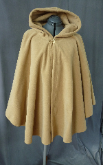 Cloak:2025, Cloak Style:Full Circle Short Cloak, Cloak Color:Camel, Fiber / Weave:Windblock Polar Fleece, Cloak Clasp:Double Spiral, Hood Lining:Self-lining, Back Length:35", Neck Length:24", Seasons:Winter, Fall, Spring, Note:This short golden tan ruana / poncho style cloak is made of  WindBloc Polar fleece, which is 100% wind resistant,<br> and has a water-repelling outer finish! It's perfect<br>for New England winters and cold, rainy, windy climates.<br>The inside of the fabric wicks up moisture keeping you dry and warm. <br>Machine washable cold gentle, tumble dry low ONCE<br>with the inside out, allow to air-dry the rest of the way..