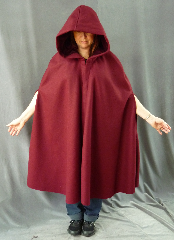 Cloak:2090, Cloak Style:Shaped Shoulder Cloak with arm slits, Cloak Color:Maroon/Burgundy/Cranberry, Fiber / Weave:Heavyweight 100% Wool Melton, Cloak Clasp:Vale, Hood Lining:Burgundy Cotton Velveteen, Back Length:39", Neck Length:23", Seasons:Winter, Fall, Spring, Note:If you need warmth with mobility, this cloak is for you.<br>Made from a heavy wool melton in cranberry red,<br>it has shaped shoulder and arm slits.<br>The hood is lined in a burgundy velveteen<br>and the cloak is finished with a pewter Vale clasp..