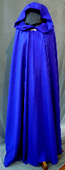 Cloak:2164, Cloak Style:Fuller Half circle, Cloak Color:Cobalt Blue, Fiber / Weave:Wool Gabardine, Cloak Clasp:Alpine Knot - Silvertone, Hood Lining:Unlined, Back Length:57", Neck Length:20", Seasons:Spring, Fall, Summer, Note:This beautiful royal blue cloak<br>is a great balance of luxury and value!<br>The actual cloak is darker than the picture.<br>The cloak is made of 100% wool gabardine<br>and features a dramatic full-sized hood<br>lined in a stunning blue crushed velvet, for even more elegance.<br>Finished with a lovely silver tone alpine style hook-and-eye clasp..