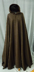 Cloak:2181, Cloak Style:Full Circle Cloak, Cloak Color:Brown, Fiber / Weave:100% Wool, Cloak Clasp:Triple Medallion, Hood Lining:Unlined, Back Length:55", Neck Length:23", Seasons:Winter, Fall, Spring, Note:This dark brown cloak is made of 100% wool basket weave fabric woven from chunky yarns.<br>  The brown is slightly heathered with gray. The generous full hood<br> is unlined, making it great for early period re-enactment..