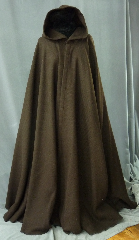 Cloak:2308, Cloak Style:Full Circle Cloak, Cloak Color:Brown, Fiber / Weave:100% Wool, Cloak Clasp:Vale - Goldtone, Hood Lining:Unlined, Back Length:56.5", Neck Length:24", Seasons:Winter, Fall, Spring, Note:This dark brown cloak is made of 100% wool<br>basket weave fabric woven from chunky yarns.<br>The brown is slightly heathered with gray. The generous full hood<br> is unlined, making it great for early period re-enactment..