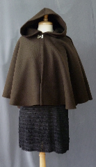 Cloak:2371, Cloak Style:Full Circle Short Cloak, Cloak Color:Brown, Fiber / Weave:100% Wool, Cloak Clasp:Double Spiral, Hood Lining:Unlined, Back Length:23", Neck Length:19", Seasons:Winter, Fall, Spring, Note:This dark brown cloak is made of 100% wool<br>basket weave fabric woven from chunky yarns.<br>The brown is slightly heathered with gray. The generous full hood<br>is unlined, making it great for early period re-enactment.<br>The smaller neck makes this a good choice for a<br>small child or petite person. Dry Clean..