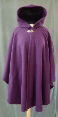 Cloak:2402, Cloak Style:Cape / Ruana, Cloak Color:Rich Plum Purple, Fiber / Weave:Pill resistant mid weight fleece, Cloak Clasp:Vale - Goldtone, Hood Lining:Self-lining, Back Length:33.5", Neck Length:23.5", Seasons:Fall, Spring, Southern Winter, Note:A cross between a cape and a cloak,<br>a ruana is a great way to keep warm when<br>frequent, unhindered use of your arms is needed.<br>Midweight washable fleece provides a lightweight warmth.<br>  Suitable for  late spring,  early fall or cool summer evenings.<br>You can even wrap up in it to watch TV,<br>safe from the savage winter drafts!.