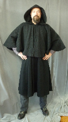 Cloak:2414, Cloak Style:Inverness Coat Cloak<br>with 22" full circle mantle<br>and arm openings, Cloak Color:Black, Fiber / Weave:Wool Boucle Cape, Lambswool Cashmere, Cloak Clasp:Black snaps, Hood Lining:Unlined, Back Length:48", 22.5" Mantle, Neck Length:22.5", Seasons:Winter, Fall, Spring, Note:This Coachman / Highwayman / Statesman<br>cloak features arm openings at the shoulder<br>and pockets on the sides.<br>The mantle is made of a soft<br>Wool Boucle over a lambswool cashmere..