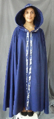 Cloak:2485, Cloak Style:Full Circle Cloak with Blue Mongol Knot trim, Cloak Color:Royal Blue, Fiber / Weave:70% Wool, 20% Cashmere, 10% nylon, Cloak Clasp:Black snaps, Hood Lining:Blue Poly Micro Velvet, Back Length:48", Neck Length:26", Seasons:Winter, Fall, Spring.