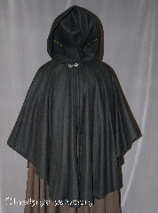 Cloak:2565, Cloak Style:Cape / Ruana, Cloak Color:Black, Fiber / Weave:Wool Flannel, Cloak Clasp:Antiquity, Hood Lining:Unlined, Back Length:38", Neck Length:21", Seasons:Fall, Spring, Note:Note: on sale due to distress - small patches.