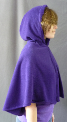 Cloak:2664, Cloak Style:Slightly Fuller Half Circle Cloak, Cloak Color:Bright Royal Purple, Fiber / Weave:Midweight Fleece with sweater weave surface, Hood Lining:Unlined, Back Length:22", Neck Length:17.5", Seasons:Fall, Spring, Southern Winter, Note:This beautiful slightly fuller half circle cloak<br>is wonderful for a child, but can be worn<br>by a petite adult as shown.<br>Machine washable cold gentle, tumble dry low..