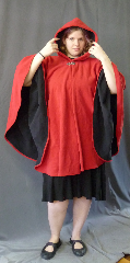 Cloak:2667, Cloak Style:Cape / Ruana, Cloak Color:Red Outside, Black Inside, Fiber / Weave:Windblock Polar Fleece, Cloak Clasp:Vale, Hood Lining:Self-lining, Back Length:35", Neck Length:21", Seasons:Winter, Fall, Spring, Note:This two toned red & black ruana / poncho style cloak<br>is made of  WindBloc Polar fleece, which is 100% wind resistant,<br> and has a water-repelling outer finish! It's perfect<br>for New England winters and cold, rainy, windy climates.<br>The inside of the fabric wicks up moisture keeping you dry and warm. <br>Machine washable cold gentle, tumble dry low ONCE<br>with the inside out, allow to air-dry the rest of the way..