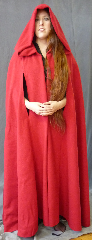 Cloak:2736, Cloak Style:Shaped Shoulder Cloak with arm slits, Cloak Color:Red, Fiber / Weave:80/20 Wool Blend, Cloak Clasp:Red Ties, Hood Lining:Unlined, Back Length:51", Neck Length:22", Seasons:Southern Winter, Fall, Spring, Note:This "Red Riding Hood Cloak" has arm slits..