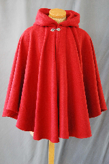 Cloak:2750, Cloak Style:Full Circle Short Cloak, Cloak Color:Red, Fiber / Weave:80/20 Wool Blend, Cloak Clasp:Vale, Hood Lining:Unlined, Back Length:33", Neck Length:20", Seasons:Winter, Fall, Spring, Note:This short full circle cloak is perfect<br>
for adding just a touch of drama and elegance.<br>Made from a red nylon/wool this cloak is soft,<br>unlined. and finished off with a classic Vale hook-and-eye clasp.<br> Dry Clean only.