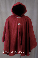 Cloak:2802, Cloak Style:Ruana Cloak Casco Bay inspired, Cloak Color:Burgundy, Fiber / Weave:80% Wool/20% Nylon, Cloak Clasp:Vale, Hood Lining:Unlined, Back Length:31", Neck Length:20", Seasons:Spring, Fall, Note:Inspired by the former Casco<br>Bay Works in Portland, Maine.<br>This gorgeous Ruana cloak is perfect for<br>cool fall evenings. Shallow cut sides<br>allow for easy arm movement for<br> driving while still providing coverage.<br>Finished with 2 Vale hook & eye clasps<br>Dry Clean only..