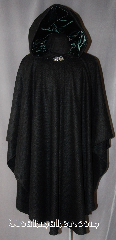Cloak:2905, Cloak Style:Cape / Ruana, Cloak Color:Black, Fiber / Weave:100% Wool, woven, Cloak Clasp:Vale, Hood Lining:Dark Emerald Green Velvet, Back Length:44", Neck Length:22", Seasons:Fall, Spring, Southern Winter, Note:This black Ruana is a great way to<br>keep warm while frequent, unhindered<br>use of your arms is needed.<br>A cross between a cape and a<br>cloak, Ruanas make great driving cloaks!<br>This gorgeous woven wool cloak<br>has a soft, elegant dark<br>emerald lined hood with 28" long sides.<br>Dry Clean Only..