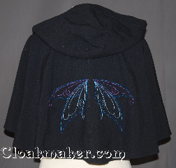 Cloak:2936, Cloak Style:Full Circle Short Capelet, Cloak Color:Navy Blue<br>with embroidered fairy wings, Fiber / Weave:Wool Blend Suiting, Cloak Clasp:Snap Button, Hood Lining:Unlined, Back Length:26", Neck Length:20", Seasons:Spring, Fall, Summer, Note:"To me, a fairy tale seems to have<br>become reality." Nelly Sachs<br>Perfect starter cloak for a child or a<br>fashionable alternative to a shawl.<br>This navy blue short capelet is made<br>of a lightweight fabric.<br>Easy to use snap clasp allows for<br> quick dressing on cool evenings.<br>There are blue and purple<br>fairy wings on the back<br>A fun addition to any wardrobe.<br>Dry Clean Only..