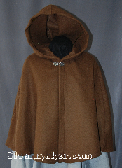 Cloak:2937, Cloak Style:Shaped Shoulder Cloak - Short, Cloak Color:Brown, Fiber / Weave:80% Wool / 20% Nylon, Cloak Clasp:Vale, Hood Lining:Unlined, Back Length:25", Neck Length:18", Seasons:Spring, Fall, Note:A felted brown wool short<br>shape shoulder cloak<br>sized for a child is<br>perfect for cool evenings.<br>Designed to grow with a child<br>into young adulthood.<br>Accented with a silvertone vale clasp.<br>Dry clean only..