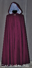 Cloak:2953, Cloak Style:Full Circle Cloak, Cloak Color:Plum Purple, Fiber / Weave:80% Wool / 20% Nylon, Cloak Clasp:Vale, Hood Lining:Periwinkle Cotton Velvet, Back Length:54.5", Neck Length:20", Seasons:Fall, Spring, Southern Winter, Winter, Note:Rich as plum cake this full circle<br>cloak has a soft complementary<br>periwinkle lined hood and<br>silver tone vale clasp..