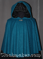 Cloak:2995, Cloak Style:Short Full Circle, Cloak Color:Teal, Fiber / Weave:100% Wool, Cloak Clasp:Vale, Hood Lining:Black Moleskin, Back Length:25", Neck Length:21.5", Seasons:Fall, Spring, Note:A lovely starter cloak for a child or adult<br>this short full circle cloak is perfect<br>for adding just a touch of<br>drama and elegance.<br>Made of 100% soft mid weight<br>teal wool with a black moleskin<br>lined hood and adorned with a<br>silver tone veil hook and eye clasp.<br>Dry clean only..