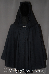 Cloak:3040, Cloak Style:Ruana, Cloak Color:Navy Blue, Fiber / Weave:100% Wool, Cloak Clasp:Stina Pewter, Hood Lining:Unlined, Back Length:30"<br>28" overarm, Neck Length:21", Seasons:Summer, Fall, Spring, Note:A cross between a cape and a cloak,<br>a ruana is a great way to keep warm<br>while frequent, unhindered use<br>of your arms is needed.<br>This navy blue wool ruana<br>is tropical weight and<br>has a dramatic<br>swoosh/drape perfect for<br>indoor and outdoor events<br> Accented with a silver tone stina<br>hook-and-eye clasp.<br>Dry Clean only..