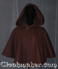 Cloak:3103, Cloak Style:Shaped Shoulder-Short, Cloak Color:Milk Chocolate Brown, Fiber / Weave:Wool, Cloak Clasp:Hidden Hook & Eye, Hood Lining:Unlined, Back Length:22", Neck Length:21", Seasons:Fall, Southern Winter, Note:A simple short shape shoulder cloak<br>for elegant evenings as a shrug<br>or childs starter cloak<br>Made of 100% wool with a<br>hidden metal hook-and-eye clasp.<br>Spot or dry clean only..