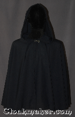 Cloak:3110, Cloak Style:Short Shape Shoulder Cloak<br>With Pointed Hood, Cloak Color:Navy Blue almost Black, Fiber / Weave:Wool Blend Suiting, Cloak Clasp:Stina Pewter, Hood Lining:Unlined pointed, Back Length:26.5", Neck Length:19.5", Seasons:Fall, Spring, Note:Lightweight and easy care,<br>in a nearly black navy,<br>this short cloak is a great piece<br>of spring outerwear.<br>Made with a breathable wool blend<br>suiting this unlined cloak  makes a<br>great accessory for everyday wear,<br> LARP or Renaissance Fair.<br>Features a pointed hood<br>The cloak is machine washable, so throw it on<br>whenever you need some extra warmth.<br>A perfect starter cloak for a child or adult.