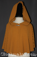 Cloak:3196, Cloak Style:pullover Capelet, Cloak Color:Tumeric yellow, Fiber / Weave:Polyester Rayon, Cloak Clasp:Stina Pewter, Hood Lining:Unlined, Back Length:20.75", Neck Length:23.5", Seasons:Summer, Spring, Fall, Note:Lightweight and cool to the touch<br>this undulant short pullover capelet<br>is a wonderful starter cloak<br>for young adults or an elegant shrug<br>for a night on the town.<br>With a keyhole neck and<br>Stina Pewter closure you can<br>throw it on and go anywhere with style.<br>Machine washable..