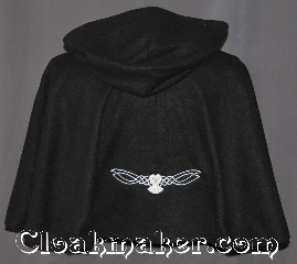 Cloak:3226, Cloak Style:Short pullover cloak, Cloak Color:Black, Fiber / Weave:Economy Fleece, Cloak Clasp:Plain Rope<br>Hook & Eye, Hood Lining:Unlined keyhole neck, Back Length:21", Neck Length:21", Seasons:Fall, Spring, Note:Then nightly sings the staring owl,<br>Tu-whit; Tu-who, a merry note.<br>-William Shakespeare.<br>A cloak for all night owls this<br>light weight economy fleece<br>black pullover circle cloak<br>has a embroidered white celtic owl<br>with glow in the dark eyes.<br>Perfect for late night walks or a snuggle.<br>Ideal for a child or young adult<br>with a keyhole neck and hidden<br>modern rope hook and eye clasp<br>Machine washable..