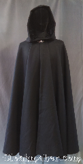 Cloak:3228, Cloak Style:Full Circle Cloak, Cloak Color:Black, Fiber / Weave:100% Wool Twill, Brushed, Cloak Clasp:Vale, Hood Lining:Crinkle black velvet, Back Length:46", Neck Length:19.5", Seasons:Southern Winter, Fall, Spring, Winter, Note:Elegant in black, this mid-weight<br>black full-circle cloak has a<br>lined crinkle velvet hood<br>with a soft wool twill body.<br>Warm enough for a southern<br>winter chill but roomy enough for<br>extra layers for when father<br>winter packs a punch.<br>Adorned with a silvertone<br>Vale hook and eye clasp.<br>Dry clean only.
