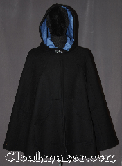 Cloak:3239, Cloak Style:Shaped Shoulder Cloak<br>Midlength with arm-slits and pockets, Cloak Color:Black, Fiber / Weave:100% Wool, Cloak Clasp:Vale, Hood Lining:Cornflower Blue Moleskin, Back Length:37", Neck Length:20", Seasons:Fall, Spring, Southern Winter, Note:This soft black shape shoulder cloak is<br>fashionable and functional with both<br>arm-slits and pockets for ease of<br>arm movement and warm hands.<br>Ideal for brisk days when you still<br>have to get things done.<br>Accented with a cornflower blue lined<br>hood and silvertone vale clasp.<br>Spot or dry clean only..