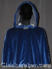 Cloak:3275, Cloak Style:Shaped Shoulder-Short, Cloak Color:Royal Blue, Fiber / Weave:Cotton Velvet, Cloak Clasp:Vale, Hood Lining:Silver silk velvet, Back Length:25", Neck Length:19", Seasons:Southern Winter, Fall, Spring, Note:A gorgeous soft royal blue<br>short shape shoulder cloak<br>is the ideal piece for<br>any prince or princess.<br>Sized for youth or lean adult<br>with a shimmer silver velvet<br>hood lining for a luxurious feel.<br>Easy care machine washable<br>Throw it on and go!<br><br>Note: slight flaw on left shoulder.