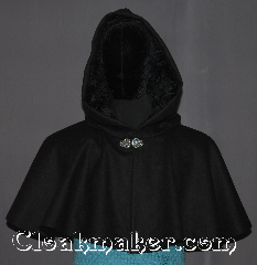 Cloak:3302, Cloak Style:Full Circle Short Cloak /Capelet, Cloak Color:Black, Fiber / Weave:100% Wool, Cloak Clasp:Vale, Hood Lining:Black Crushed Velvet, Back Length:16", Neck Length:24", Seasons:Winter, Southern Winter, Fall, Spring, Note:A perfect short capelet starter cloak<br>or formal evening during cold receptions.<br>Made of a warm black wool and<br>adorned with a elegant vale pewter clasp.<br>Dry or spot clean only..