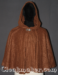 Cloak:3363, Cloak Style:Full Circle Cloak Short<br>3 pieces, Cloak Color:Caramel Brown, Fiber / Weave:Fleece, Cloak Clasp:Vale, Hood Lining:Unlined, Back Length:24", Neck Length:21", Seasons:Fall, Spring, Note:A cloak that will last from childhood to<br>adult this lightweight economy fleece<br> provides a warmth with very little weight.<br>This caramel full circle three piece cloak<br>is suitable for indoor wear late spring,<br>early fall, cool summer evenings or<br>just snuggling on the couch.<br>Easy care machine washable..
