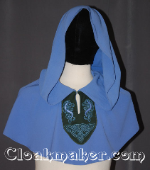 Cloak:3470, Cloak Style:Unique pullover capelet<br>with lirepipe hood / embroidery, Cloak Color:Periwinkle Blue, Fiber / Weave:Wool Blend Suiting cotton panel, Cloak Clasp:Hidden Hook & Eye clasp<br>keyhole neck with embroidery, Hood Lining:Unlined<br>with 43" lirapipe, Back Length:13.5", Neck Length:20", Seasons:Fall, Spring, Summer, Note:A unique piece with a medieval flair<br>this periwinkle blue pullover has a<br>hunter green celtic horse and knot<br>embroidered panel with a keyhole neck<br>and hidden hook and eye clasp.<br>The  43" Lirepipe hood<br>is useful as storage or a scarf on<br>windy days.<br>Handwash lay flat to dry..