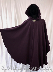 Cloak:3542, Cloak Style:Ruana Shaped Shoulder Cloak, Cloak Color:Dark dusty plum purple, Fiber / Weave:WindPro Fleece, Cloak Clasp:Triple Medallion, Hood Lining:Unlined matching Shearling interior<br>double sided fabric, Back Length:44.5" back<br>28" overarm, Neck Length:22", Seasons:Winter, Southern Winter, Fall, Spring, Note:A regal plumb windpro ruana cloak that<br>will keep you warm and dry on chilly nights.<br>A cross between a cape and a cloak,<br>a ruana is a great way to keep warm<br>while frequent, unhindered use of<br>your arms is needed.<br>With an overarm of 30" this cloak<br>has less bulk than a<br>traditional Ruana and<br>makes a great driving cloak!<br>This soft and cuddly cloak has an<br>interior faux shearling texture<br>for extra comfort and a water<br> resistant outer layer to keep<br> you dry during light rain/snow.<br>The silver-tone triple medallion clasp<br>is the final touch on this<br>functional and elegant cloak.<br>Machine washable<br>DO NOT DRY CLEAN..