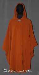Cloak:3548, Cloak Style:Ruana Shaped Shoulder Cloak, Cloak Color:Burnt Sienna, Fiber / Weave:WindPro Fleece, Cloak Clasp:Triple Medallion, Hood Lining:Unlined matching Shearling interior<br>double sided fabric, Back Length:46" back<br>31" side, Neck Length:21", Seasons:Winter, Southern Winter, Fall, Spring, Note:A pumpkin spice/ burnt sienna windpro<br>ruana shaped shoulder cloak will<br>keep you warm and dry on chilly nights.<br>This soft and cuddly cloak has a interior<br>faux shearling texture for extra comfort.<br>A cross between a cape and a cloak,<br>a ruana is a great way to keep warm<br>while frequent, unhindered use of<br>your arms is needed.<br>With an overarm of 31" this cloak<br>has less bulk than a<br>traditional Ruana and<br>makes a great driving cloak!<br>The final touch on this functional<br>and elegant cloak is a water resistant outer<br>layer to keep you dry during light rain/snow.<br>Machine washable.