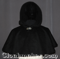 Cloak:3559, Cloak Style:Full Circle Cloak<br>Short Capelet, Cloak Color:Black, Fiber / Weave:Wool Cashmere Blend, Cloak Clasp:Vale, Hood Lining:Unlined, Back Length:17.5", Neck Length:20.5", Seasons:Winter, Southern Winter, Fall, Spring, Note:This black cashmere blend mantle<br>will keep winter's chill off your<br>shoulders for an elegant night out<br>for you or your child.<br>This soft wool short cape<br>is ideal for formal winter outdoor events<br>when you need a little extra warmth.<br>Can be layered on top of other cloaks etc.<br>Spot or dry clean only..