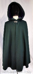 Cloak:3674, Cloak Style:Shaped Shoulder Cloak, Cloak Color:Forest green, Fiber / Weave:80% wool, 20% nylon, Cloak Clasp:Vale, Hood Lining:Purple velvet, Back Length:40", Neck Length:21", Seasons:Southern Winter, Spring, Fall, Note:Walk through the greenery in this<br>forest green shaped shoulder cloak<br>with a purple velvet hood lining.<br>A silvertone vale clasp keeps in<br>the warmth on Autumn evenings.<br>Dry clean only..