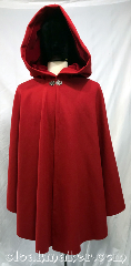 Cloak:3767, Cloak Style:Shaped Shoulder Cloak, Cloak Color:Crimson Red, Fiber / Weave:80% wool, 20% nylon, Cloak Clasp:Vale, Hood Lining:Red Velveteen, Back Length:33", Neck Length:22", Seasons:Southern Winter, Winter, Spring, Fall, Note:A crimson red shaped shoulder ruana<br>style cloak in felted wool melton with<br>a red cotton velveteen hood lining.<br>This cloak is a lighter winter weight<br>with some wind resistance.<br>Made from a wool blend, dry clean only..