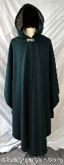 Cloak:3771, Cloak Style:Shaped Shoulder Ruana, Cloak Color:Forest Green, Fiber / Weave:80% wool, 20% nylon, Cloak Clasp:Triple Medallion, Hood Lining:Mousy grey silk velvet, Back Length:54", Neck Length:21", Seasons:Southern Winter, Spring, Fall, Note:A forest green shaped shoulder<br>ruana cloak with mantle made<br>from a wool blend.<br> Adorned with a mousy grey silk velvet<br>hood lining and a silvertone<br>triple medallion clasp.<br>Dry clean only..