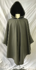 Cloak:3772, Cloak Style:Cape / Ruana, Cloak Color:Sage Green, Fiber / Weave:100% wool, Cloak Clasp:Vale, Hood Lining:Black silk Velvet, Back Length:42", Neck Length:23", Seasons:Winter, Southern Winter, Spring, Fall, Note:100% wool in sage green, this ruana<br>style cloak has a silvertone vale clasp<br>and a black silk velvet hood lining.<br>Dry clean only..