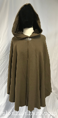 Cloak:3826, Cloak Style:Shaped Shoulder Ruana, Cloak Color:Cocoa Brown, Fiber / Weave:100% wool, Cloak Clasp:Vale, Hood Lining:Brown velour, Back Length:33", Neck Length:21", Seasons:Fall, Spring, Note:Cocoa brown shaped shoulder<br>ruana style cloak made from<br>100% wool.<br>Adorned with a brown velour hood lining<br>and a silvertone vale clasp.<br>Dry clean only..