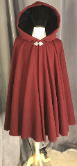 Cloak:3859, Cloak Style:50"-55" Circle Cloak, Cloak Color:Maroon red, Fiber / Weave:wool blend, plush wool coating, Cloak Clasp:Triple Medallion, Hood Lining:Navy Blue Cotton Velvet, Back Length:39", Neck Length:22.5", Seasons:Spring, Fall, Southern Winter, Note:This lovely cloak is made from a<br>beautiful maroon plush wool coating<br>in a 80/20 wool/nylon blend.<br>Finished with a navy blue cotton<br>velvet hood lining and silver tone<br>triple medallion clasp.<br>Dry clean only.