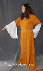 Gown ID:G764, Gown Color:Mustard Yellow, Style:12th Century<br>(shown with CT041558JU circlet and<br>Diamond Shield Plaque<br>Belt BT0014BZ<br>sold separately), Sleeve:Long Drop White Polyester<br> shimmer Sleeve<br>with Celtic knot blue and red<br>trim at bicep, Trim:Celtic knot blue and red trim at bicep, Neckline Type:Scoop, Fabric:Rayon and polyester shimmer sleeves, Sleeve Length:30", Back Length:58".