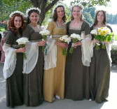 A wedding photo of a bridal party wearing custom-made (12th century) bridesmaid's gowns.