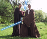 Two men dressed as Jedi in replica Obi Wan Kenobi and Anakin costumes from the Star Wars trilogy.