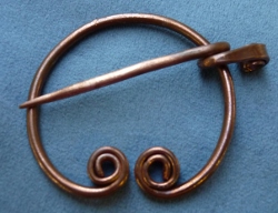 Copper
                        Penannular with curlicue ends
