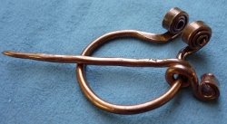 Copper Penannular
                        with Outward facing curlicue ends