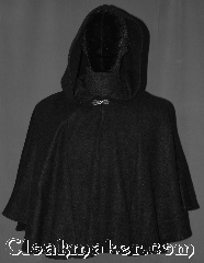 Cloak:3220, Cloak Style:Short pullover cloak, Cloak Color:Black, Fiber / Weave:Economy Fleece, Hood Lining:Unlined keyhole neck, Back Length:23" back<br>22" sides, Neck Length:22", Seasons:Fall, Spring, Note:A light weight economy fleece<br>black shape shoulder pullover cloak<br>you would love to snuggle.<br>A perfect starter cloak for a<br>young adult with a keyhole neck.<br>  Designed with less bulk<br>for easy arm mobility.<br>Spot dry clean only..
